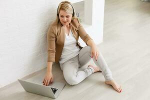 Creative workspace, woman working online on laptop at home photo