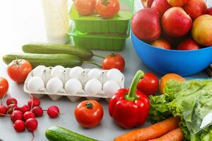 healthy food background, vegetables, fruits, eggs and dairy products on white table, top view photo