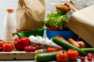 healthy food background, vegetables, fruits, eggs and dairy products on white table, top view photo