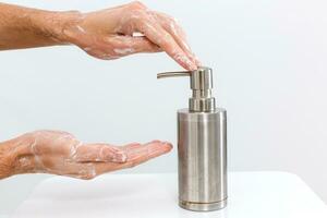 Close up image of washing hand against white background photo