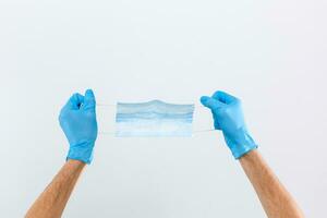 Hand give to surgical mask for protect PM 2.5 and corona virus isolated on white background with clipping path photo