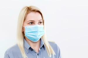 Businesswoman with protecting mask on her lips photo
