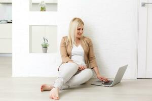 Creative workspace, woman working online on laptop at home photo