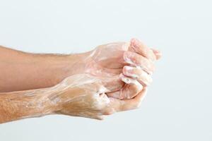 Close up image of washing hand against white background photo