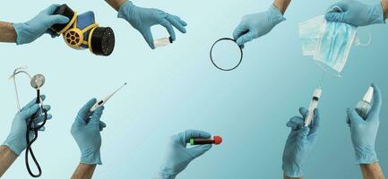 many hands holding medical tools on blue photo