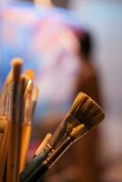 Paint brushes of creative artist in art workshop. Modern artwork paint on canvas, creative, contemporary and successful fine art artist drawing masterpiece photo