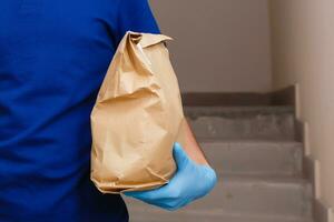 food delivery man in protective mask photo