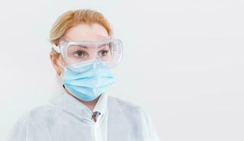 woman with a medical mask for protection again influenza. Copy space for your text. photo