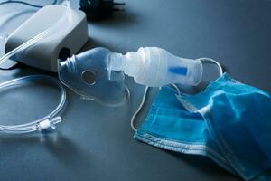 Compressor nebulizer with mask on table photo