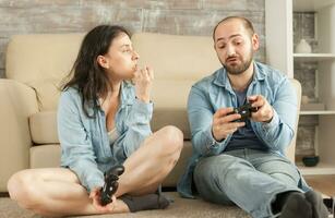 Couple having an argue after losing at online video games photo