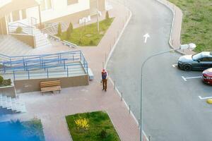 food delivery man on empty street producer of quarantine photo