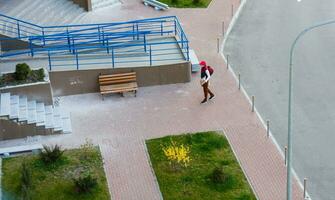 food delivery man on empty street producer of quarantine photo