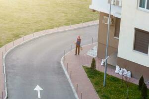 food delivery man on empty street producer of quarantine photo