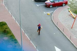 food delivery man on empty street producer of quarantine photo