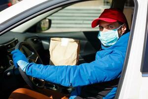 Coronavirus Covid-19 infection.masked delivery man, epidemic photo