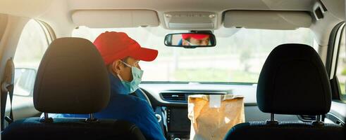 Coronavirus Covid-19 infection.masked delivery man, epidemic photo