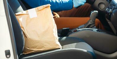 food delivery man Wearing Medical Mask. Corona Virus Concept photo