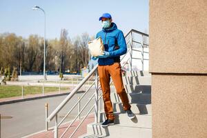 food delivery man Wearing Medical Mask. Corona Virus Concept photo