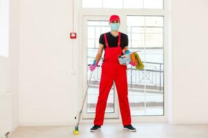 Disinfection For Virus Killing. Worker in Protection Mask cleaning Interior Using Chemical Agents To Stop Spreading Virus Infections. photo