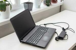 Image of charging a laptop photo