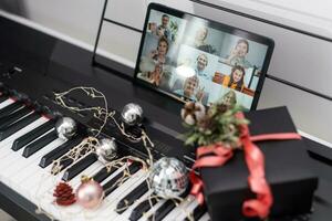 Christmas video call tablet. synthesizer, piano keys photo