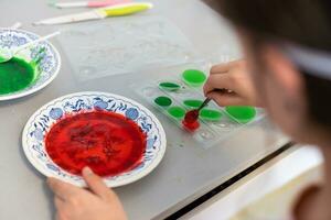 Children are learning and doing science experiments. Little girl playing science experiment for home schooling. Easy and fun science experiments for kids at home. photo