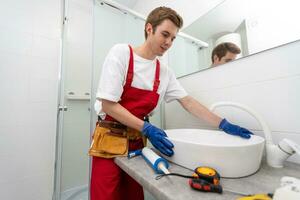 plumber service. wash basin installation photo