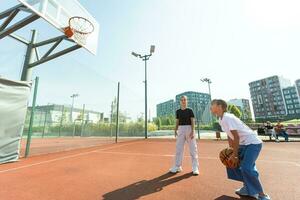 children schoolchildren playing a match about basketball against the background photo