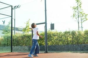 Nice girl with racket in hands playing game of tennis photo