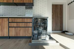 Dishwasher in modern kitchen. Perfectly washing dishes photo