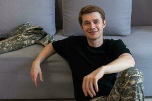 Portrait of caucasian soldier in uniform smiling photo