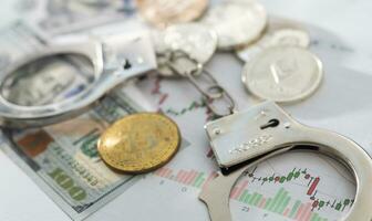 silver handcuffs on many large euro notes photo