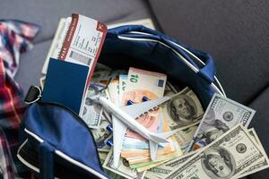 Airline tickets and documents on wooden table, top view photo