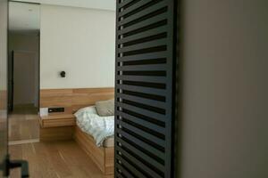 Hotel interior room, Condominium or apartment doorway with open door in front of blur bedroom background. photo
