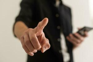 Hand pointing at observer isolated on white background. photo