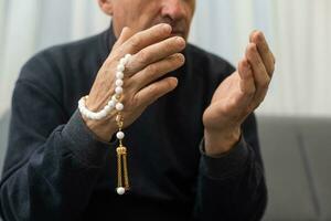 Elderly Muslim Arabic man praying. photo