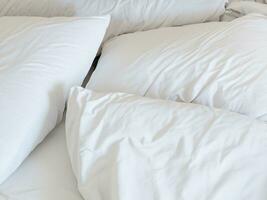 white comfortable pillows on bed photo