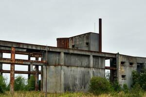 abandoned factory building in the landscape AI Generative photo