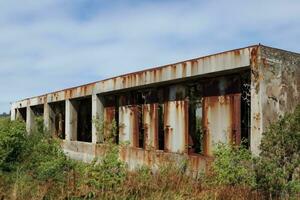 abandoned factory building in the landscape AI Generative photo