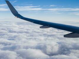 view from airplane with clouds and airplane wing AI Generative photo