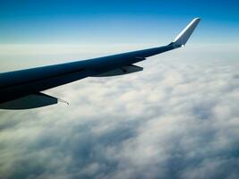 view from airplane with clouds and airplane wing AI Generative photo