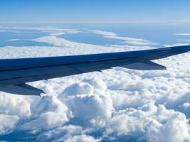 view from airplane with clouds and airplane wing AI Generative photo