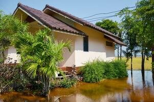 flooded house after heavy rain in thailand photo