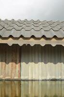 old wooden roof with metal texture. background of a old house. photo