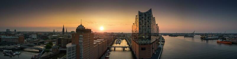 Panorama of the Elbphilharmony, Hafencity and Speicherstadt in Hamburg at sunrise photo