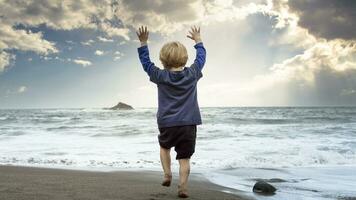 Small child playing on the beach photo