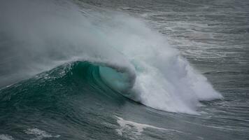 Close up of waves of the atlantic at sunset near nazare photo