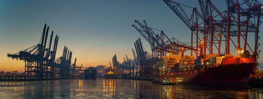 Container terminal in the port of Hamburg in the morning in freezing temperatures photo