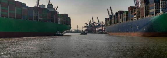 Large container ship arrives in port photo