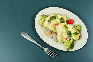 Egg omelette with vegetables and shrimp. photo